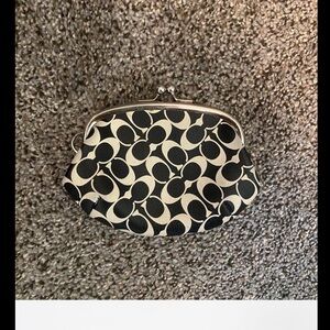 Coach Black and White/ Cream Coin Purse Signature Pattern and Kiss Lock Closure.
